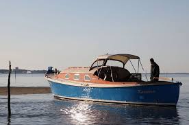 Fitting an inboard engine in an open hull is not an easy task. Classic Center Console Boat With Cabin Afriqua Queen 15 50m 50 11 Dubourdieu Videos Boat Center Console Boats Wooden Boat Plans