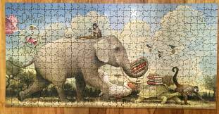 Cropped shot of man and woman with white puzzle pieces on blue backdrop, cooperation concept. Snapping Into Place Jigsaw Puzzles Have Ardent Following Wtop