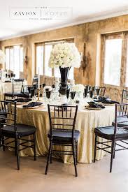 Gatsby Inspired Wedding With Black And White Decor White Roses And White Orchids Black Tiffany White Floral Arrangements Black And White Decor Tiffany Chair