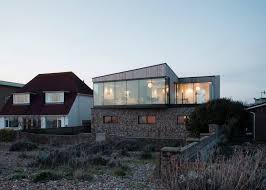 This saltbox house was completely renovated by peninsula architects and donna elle project team: Shoreham Beach House By Abir Architects Has Beach Pebble Walls