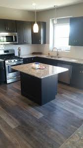Maybe you would like to learn more about one of these? Granite Countertops And Island With Overhang Coretec Alabaster Oak Flooring Stainless Ste Kitchen Cabinets Home Depot Oak Kitchen Kitchen Cabinet Door Styles