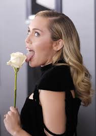 Why did these celebs wear a white rose to the Grammys this year?