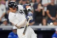 Judge rallies Yankees past Blue Jays 9-6 to save season and avert ALDS sweep