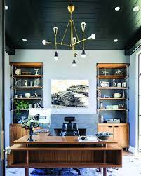 A unique home office with a reclaimed wood desk, a rattan chair and lots of unusual artworks. Inspiring Lighting Your Home Office On This Favorite Site Home Office Design Office Interiors Modern Office Decor