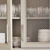 Kitchen cabinet with metal mesh on the door and sides. 1
