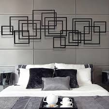 The mounting brackets on the back allow the art. 47 2 X 19 7 Geometric Rectangular Black Metal Wall Decor