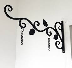A hanging sign is the perfect way to make sure your business has a presence in the high street. Office Home Hanging Sign Bracket Outdoor Black Iron Decorative Black Metal Scroll Brackets For Door Signs Hot Sale Door Plates Iron Brackets Iron L Bracketsbracket L Aliexpress