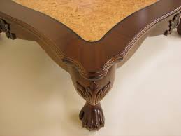 This dining table reflects highly decorative details, pedestal table, oversized claw feet, and decorative carving inlay veneers on an apron. Ball And Claw Lions Foot Coffee Table Finewoodworking