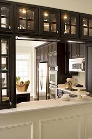 Hanging upper kitchen cabinets is the next step in this series. See Thru Kitchen Cabinets For A Light And Bright Kitchen