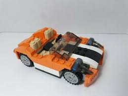 The number and type of pieces this kit contains a mix of black and orange pieces with a gray curved piece that can be used as a cockpit/windshield. Lego Creator Set 31017 3 In 1 Orange Sports Car Vehicle Sunset Speeder Lego Lego Creator Sets Lego Creator Lego