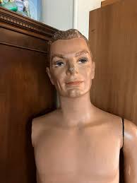 Boot Hill Ghost is a fairly modern photo (taken in 1996) of a man in the  foreground standing in Tombstone Arizona's famous Boot Hill Cemetery  adorned in classic cowboy gear, wearing a