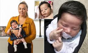 Baby girl is born with a marvellous head of thick black hair