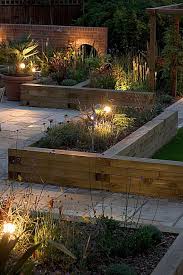 Softwood Timber Raised Sleeper Beds Gardening Take In Summer Fairy Lights Can Add A Touch Of Gla Backyard Landscaping Garden Bed Layout Diy Raised Garden