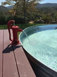 Great Idea For Your Stock Tank Pool Use An Old Fashioned Hand Pump For A Small Fountain Stock Tank Swimming Pool Tank Swimming Pool Stock Tank Pool