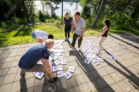If you are looking for a quick, free, easy online crossword, you've come to the right place! High Angle View Of Friends Solving Crossword Puzzle On Patio Stock Photo Picture And Royalty Free Image Image 84186560