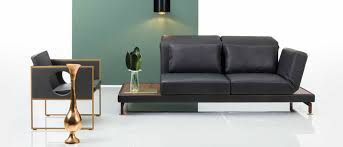 Unter der armlehne des sofas befindet sich eine tischablagefläche. Bruhl Schlafsofa De