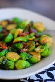Roasted brussels sprouts are a healthy side dish that goes with just about everything. Roasted Brussel Sprouts Almonds Dates Baker Bettie