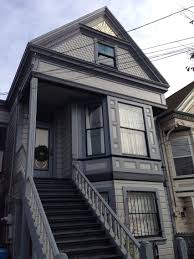 Queen Anne Row House With Sunburst Gable Decoration Porch Trim Victorian Homes House Exterior