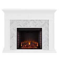 Electric fireplaces draw in air, heat it internally using a coil, and push the warm air back out into the room via a fan. Southern Enterprises Torlington Tiled Marble Electric Fireplace In White Fe1009359