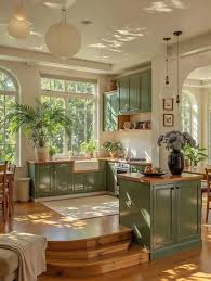 Sage green cabinets and warm wood. 🤎🌿 Love the color or too much green?  📸 @royaie_aram_decorative