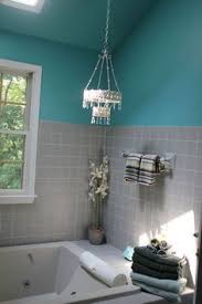 A bold turquoise powder room with brass fixtures and elegant touches. Grey And Teal Bathroom Decor Novocom Top
