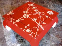 This table features a rectangular wood top painted red with intentional yellow paint distressing and rests on four red wooden farmhouse style turned wood legs. How To Paint And Stencil An Old Wood Table How Tos Diy