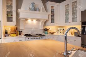Ideally, your fridge should be placed on a base level of the cabinet, and other shelving that may be limiting airflow within should be removed. Modern Room Interior Showing Kitchen Top Fridge Stove And Kitchen Stock Photo Picture And Royalty Free Image Image 151829314