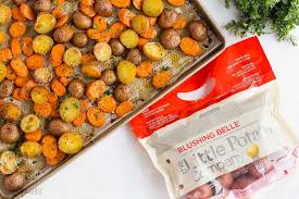 These Easy Roasted Potatoes And Carrots Are Tossed In Garlic Butter And Roasted To Pe Roasted Potatoes And Carrots Side Dish Recipes Easy Easy Roasted Potatoes