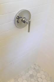 There are 409 hexagon marble tile for sale on etsy, and they cost $15.79 on average. Marble Hex Shower Floor With White Subway Tiles Transitional Bathroom