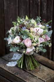 Natural And Rustic Bridal Bouquet Containing Spring Flowers And David Austin Garden S Daisy Wedding Flowers Spring Wedding Flowers Wedding Flowers Wildflowers