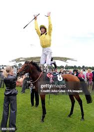 Jockey Frankie Dettori does his trade mark leap from Opinion Poll... News  Photo