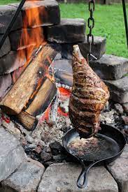 Herb Marinated Hanging Leg Of Lamb Over The Fire Cooking Recipe Fire Cooking Lamb Cooking