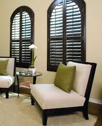 Custom Shutters Can Be Made To Cover Arch Top Windows These Shutters Are Split Down The Mid Living Room Blinds Window Shutters Indoor Interior Window Shutters
