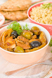 Add the chicken and turn over so that it is thoroughly coated with the marinade. Chicken Tagine Moroccan Chicken Tagine With Olives Preserved Lemon And Fennel Served With Couscous Stock Photo Picture And Royalty Free Image Image 49876611