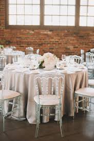 Style Me Pretty Gallery Inspiration Wedding Table Arrangement Table Arrangements Wedding Minimalist Wedding Decor Wedding Chairs