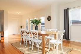 contemporary dining family home polished floorboards timber dining table white cross back dini beach house dining room timber dining table dining table rug