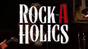 Rockaholics, playing Def Leppard's "Rock Rock (Till You Drop)" with Kim  Lusk