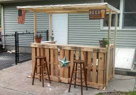 This bar is made out of old discarded pallets and covered with palings & a red gum top and shelf. I Made A Backyard Bar Out Of Pallets Diy Outdoor Bar Pallet Bar Diy Diy Outdoor Bar Ideas