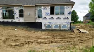 Some houses are built on a slope or gradient such that part of the main floor is above ground. Why You Need A French Drain For Homes With Daylight Basement Windows Youtube