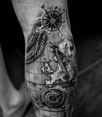 Simple geographic rendition makes an appearance on the nape. Creative Map Tattoos For The Traveling Type Map Tattoos Compass Tattoo Design Compass And Map Tattoo