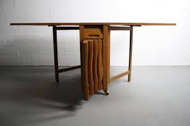 About The Danish Modern Drop Leaf Hide Away Table This Is Such A Great Find Its A 1960s Mid Century Modern Teak Drop Drop Leaf Table Leaf Table Folding Chair