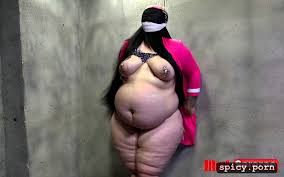 Image of 2 curvy busy fat large bbw arab woman inside a bdsm sex dungeon  she is blindfolded with a belly button piercing - spicy.porn