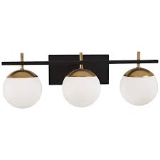 It's made with a circular metal backplate in a gold finish, and has an arched arm made from black metal that ends in a dangling cord. George Kovacs Alluria 24 W Black And Gold 3 Light Bath Light 56h30 Lamps Plus
