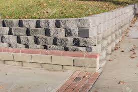 Shea concrete's extensive concrete retaining wall block inventory can be found in our online catalog. Residential Retaining Wall Featuring A Variety Of Stacked Blocks Stock Photo Picture And Royalty Free Image Image 94747249