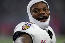 Lamar Jackson breaks NFL QB rushing record, accounts for 3 TDs in Ravens'  31-2 romp over Texans