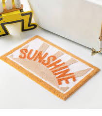 Experience the luxurious feel of a bathroom rug that doesn't slip and slide around the tile floor with the extra cushion and grippy bottoms of these mats. Peppery Home Sunshine Good Bath Mats Yellow Bathroom Rugs
