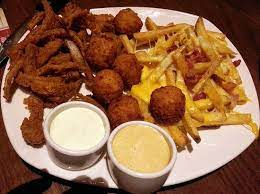 Add macaroni to sauce, and stir to combine. Aussie Signature Sampler With Onion Petals Mac Cheese Bites Cheese Fries Picture Of Outback Steakhouse Skokie Tripadvisor