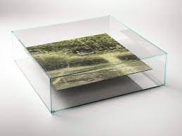 While it isn't technically a marble table (it's crafted from fibreglass with a resin coating, hence its modest price tag), it could fool anyone with the strikingly realistic marble design. Square Marble And Glass Coffee Table At Swim Two Tables By Claste