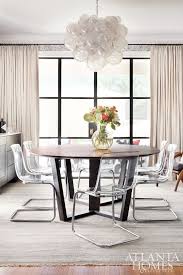 The Dining Room Is A Captivating Space Featuring A Muriel Bubble Chandelier From Oly Custo Dining Room Chairs Modern Casual Dining Rooms Acrylic Dining Chairs