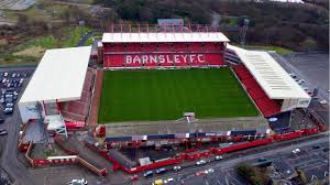 There is also an electric scoreboard at one corner of the north stand, on top of a security control room. Oakwell Stadium Barnsley Football Club